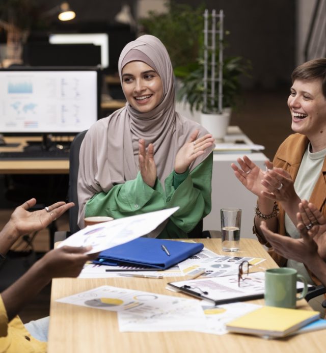 Optimized-close-up-happy-colleagues-cheering